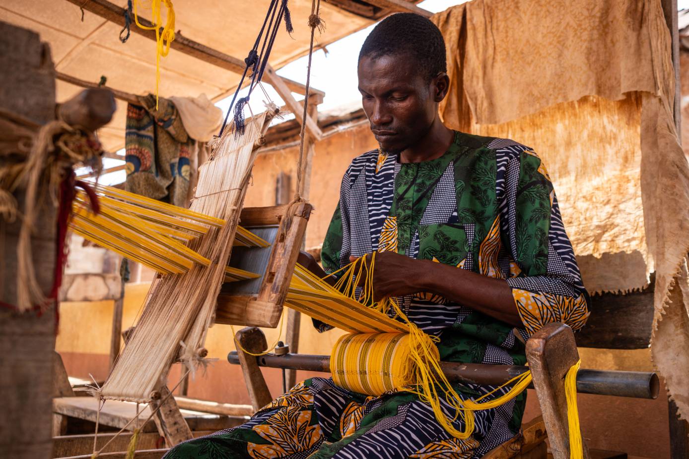 Nigeria’s Handwoven Fabric Makers Defend Tradition Against Automation 12 afp 20260410 a6fj6lx v1 highres nigeriatextileculturefashion xq18tkmd 2026 04 10