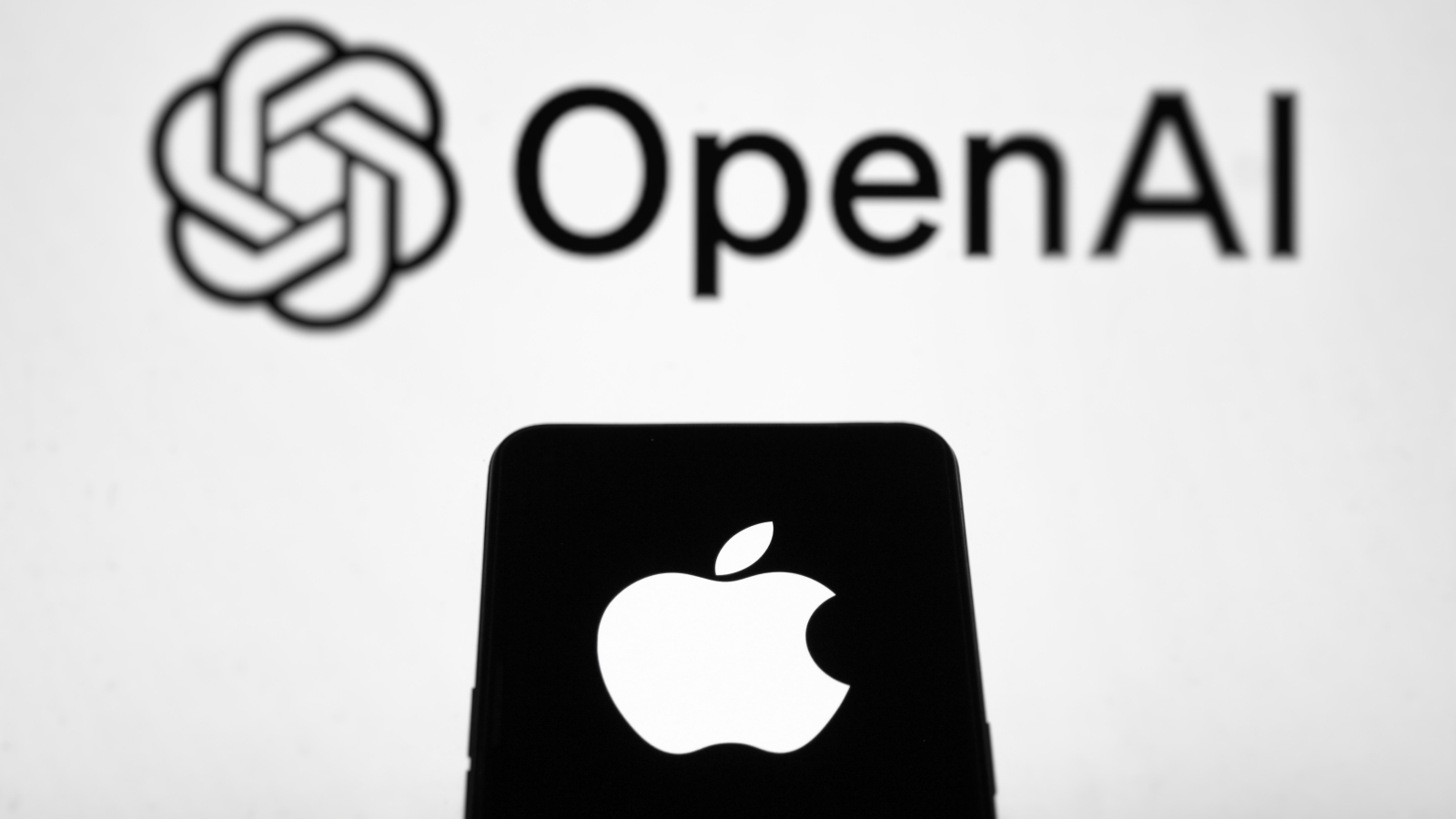 Apple Sues OpenAI for Allegedly Stealing Trade Secrets 2 openai logo apple logo on smartphone shutterstock